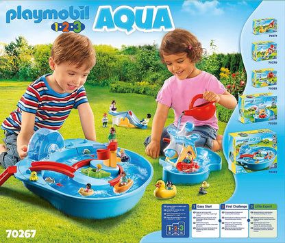 Two young children playing outside with Playmobil 1.2.3 Aqua water playsets, pouring water and watching toy boats float, with product packaging and other sets displayed on the side