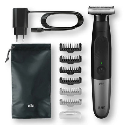 Braun XT5 trimmer set with six comb attachments, travel pouch, charging cable, and protective cap shown laid out